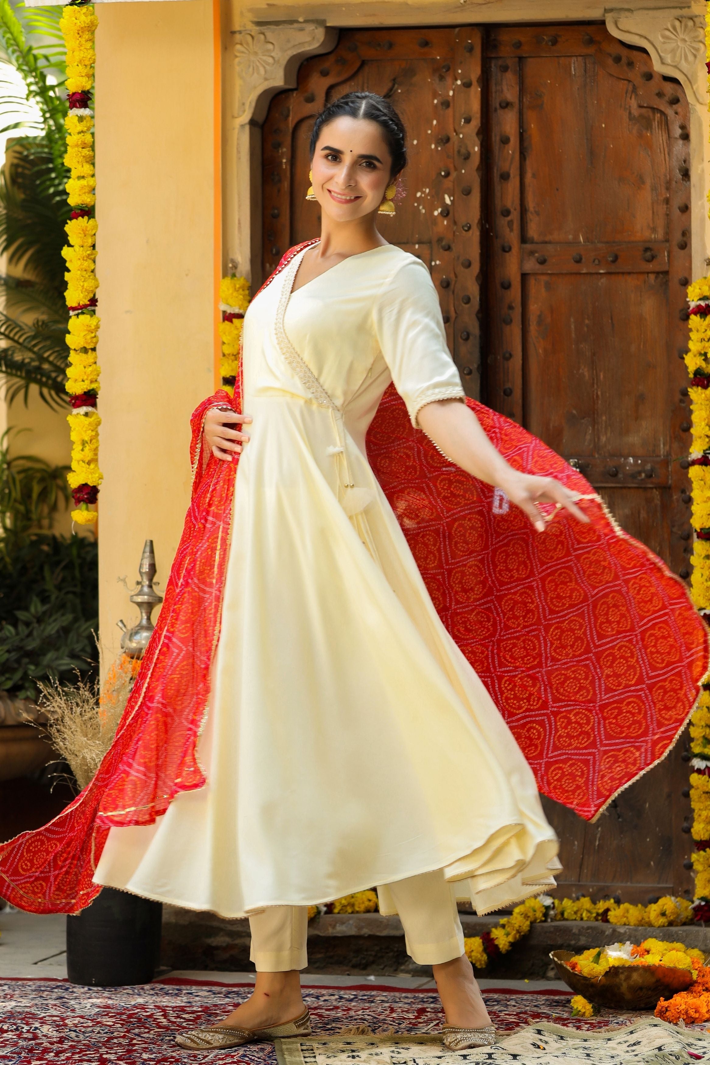 White suit shop with red dupatta